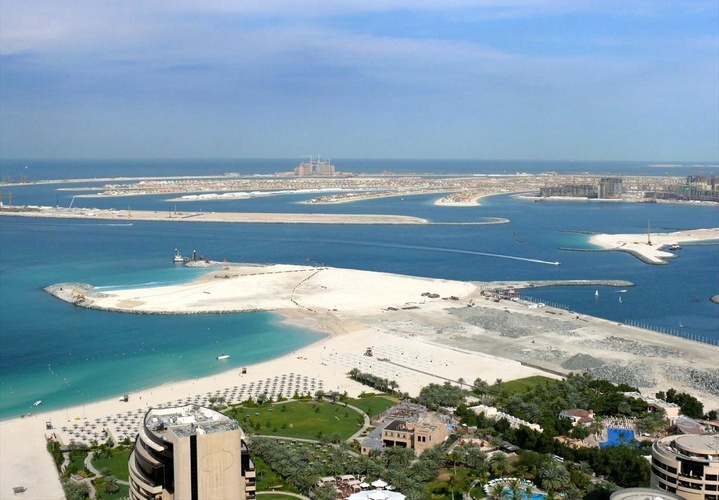 This is a photo of the Palm Jumeirah, located in Dubai, United Arab Emirates, on 19 January 2008. The piece of undeveloped land seen in the foreground is the future site of Dubai Promenade. This photo was taken form Jumeirah Beach Residence.
