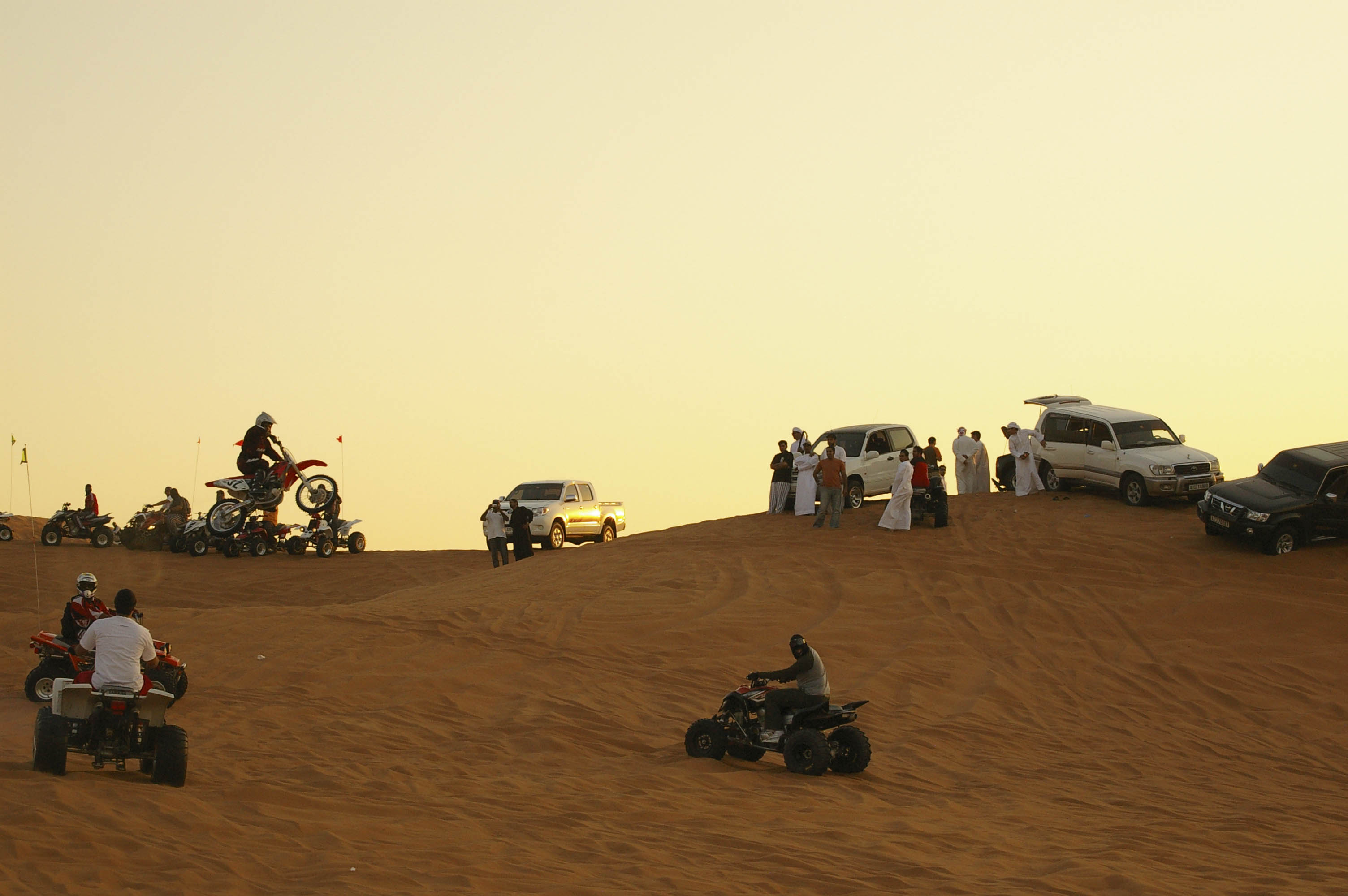 motorbikes and quad riding ride, sand dunes in desert of Dubai, UAE, November 2007