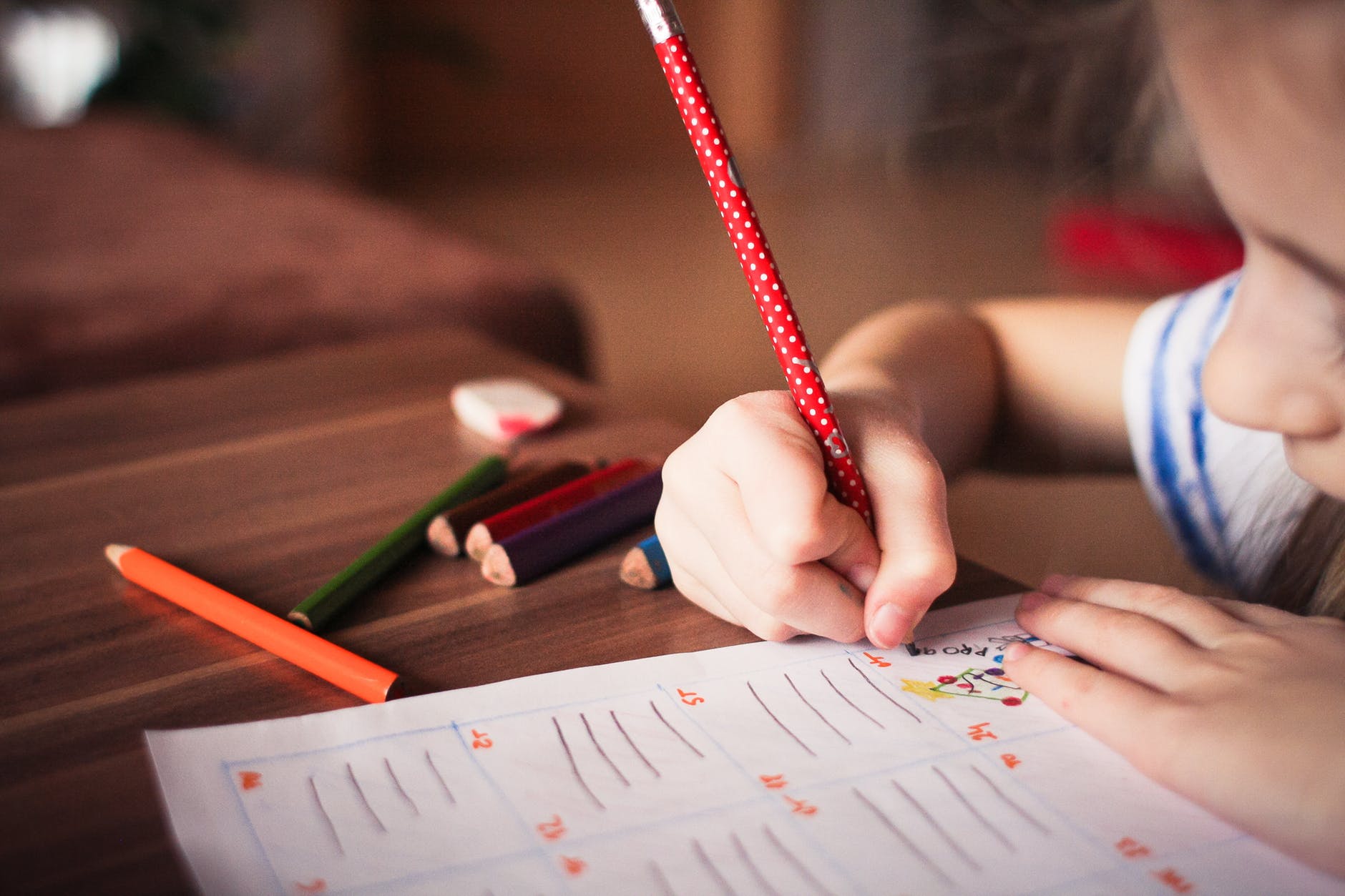 A girl writing in the notebook