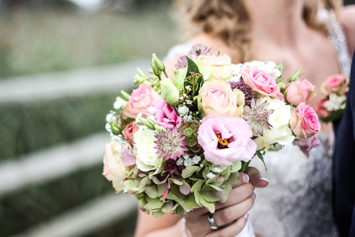 Bride holding flower bouquet