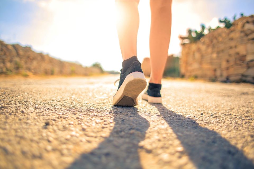 Woman Walking on Pathway