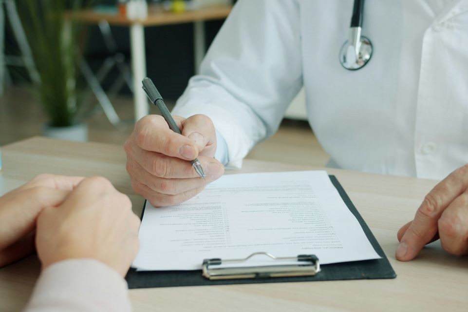 Doctor writing prescription